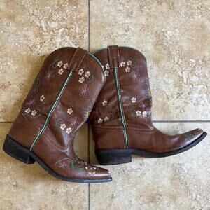 Brown leather cowboy boots with floral embroidery and turquoise inner lining